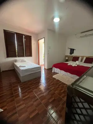 Uma cama ou camas num quarto em Pérolas Beach Hotel