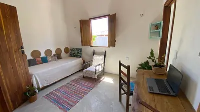 Uma cama ou camas num quarto em Casa da Tânia Preá