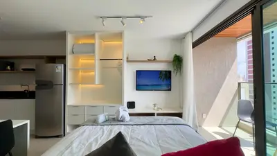 Uma televisão e/ou sistema de entretenimento em Studio Ônix no Beach Class Meireles