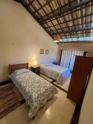 Uma cama ou camas num quarto em Casa Praia Uruau