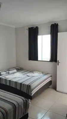 Uma cama ou camas num quarto em Flat Paulista 10
