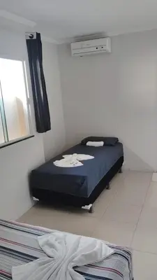 Uma cama ou camas num quarto em Flat Paulista 10