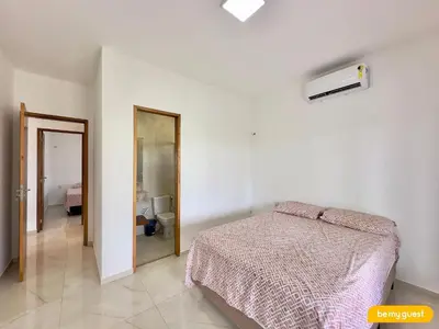 Uma cama ou camas num quarto em Clube Mirante do Iguape