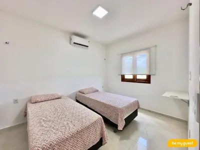 Uma cama ou camas num quarto em Clube Mirante do Iguape