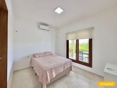 Uma cama ou camas num quarto em Clube Mirante do Iguape