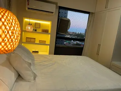 Uma cama ou camas num quarto em Flat av beira mar lindo e aconchegante