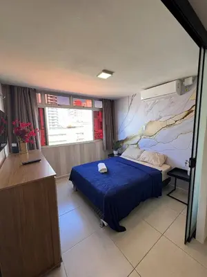 Uma cama ou camas num quarto em FLAT com vistar localizaçao TOP