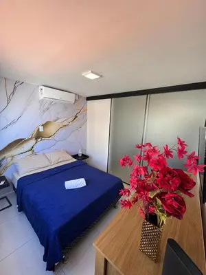 Uma cama ou camas num quarto em FLAT com vistar localizaçao TOP