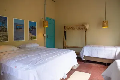 Uma cama ou camas num quarto em Casa Cajuzal Carrapateira