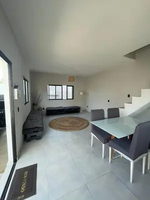 Uma área de estar em Taiba House