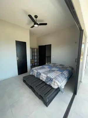 Uma cama ou camas num quarto em Taiba House