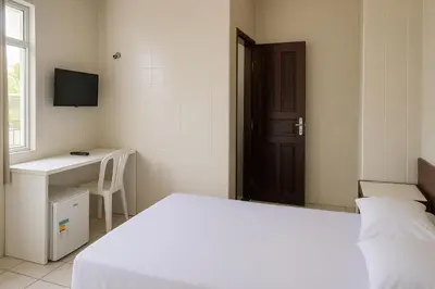 Uma cama ou camas num quarto em Hotel Lídia