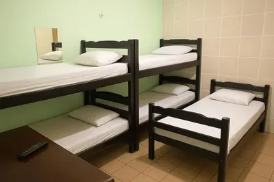 Uma cama ou camas num quarto em Hotel Lídia