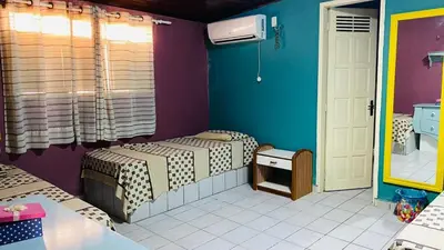 Uma cama ou camas num quarto em Maravilhosa casa com piscina