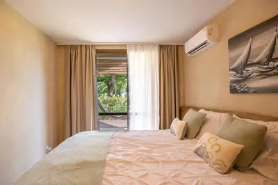 Uma cama ou camas num quarto em Apartamento Tamy Wai Wai
