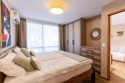 Uma cama ou camas num quarto em Apartamento Tamy Wai Wai