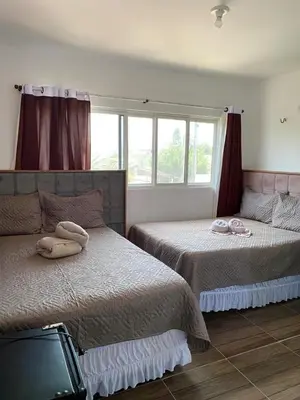 Uma cama ou camas num quarto em Pousada Ap