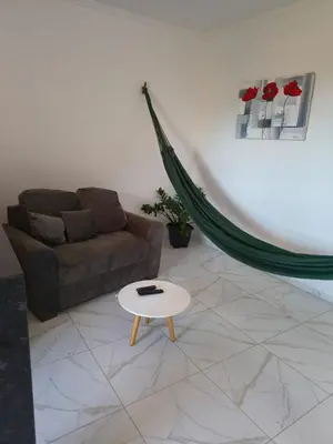 Uma área de estar em Pousada Apart Praia Uruaú