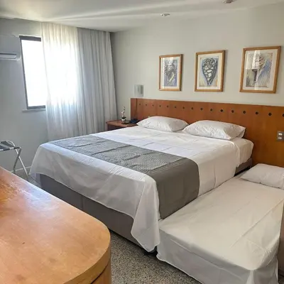 Uma cama ou camas num quarto em Flat Beira Mar para até 4 pessoas