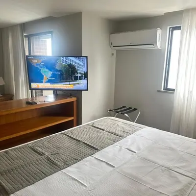 Uma cama ou camas num quarto em Flat Beira Mar para até 4 pessoas