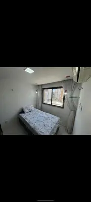Uma cama ou camas num quarto em Apartamento por temporada Edifício Amazonas