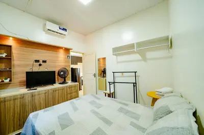Uma cama ou camas num quarto em Flat Completo p 2 pessoas Proximo ao Aeroporto