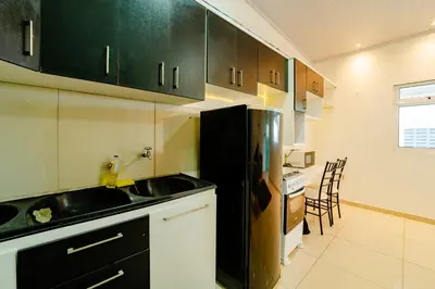 A cozinha ou kitchenette de Flat Completo p 2 pessoas Proximo ao Aeroporto