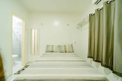 Uma cama ou camas num quarto em Flat Pet Friendly prox ao Aeroporto