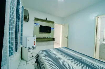 Uma cama ou camas num quarto em Flat com Wi-Fi proximo ao Aeroporto