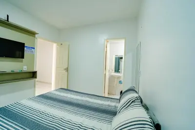 Uma cama ou camas num quarto em Flat com Wi-Fi proximo ao Aeroporto
