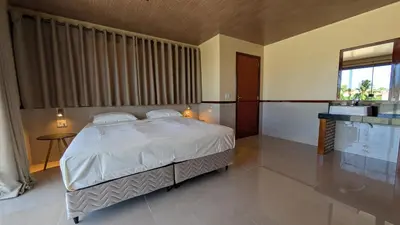 Uma cama ou camas num quarto em Parawing Paracuru