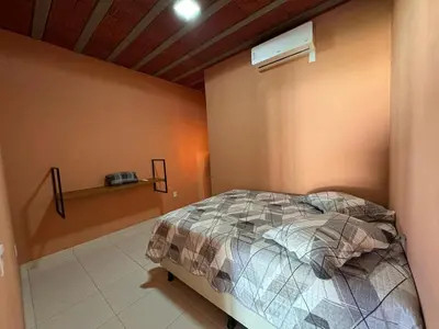Uma cama ou camas num quarto em Recanto do Aconchego