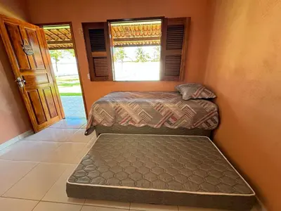 Uma cama ou camas num quarto em Recanto do Aconchego