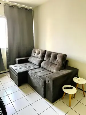 Uma área de estar em Apartamento Econômico e Aconchegante de 2 quartos