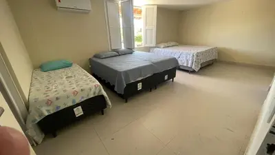 Uma cama ou camas num quarto em Casa Beach park