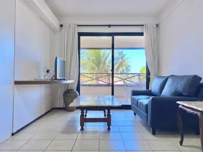 Uma área de estar em Apartamento em condomínio com acesso à praia