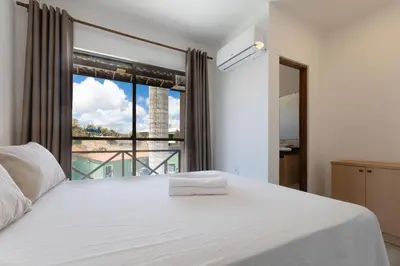 Uma cama ou camas num quarto em Beachfront Duplex #A3 - Beira mar por Carpediem