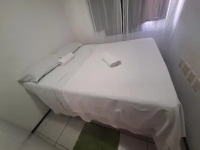 Uma cama ou camas num quarto em Piscina na Cobertura