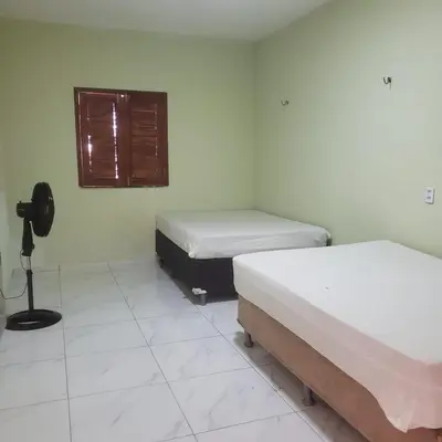 Uma cama ou camas num quarto em Casa paraíso natural