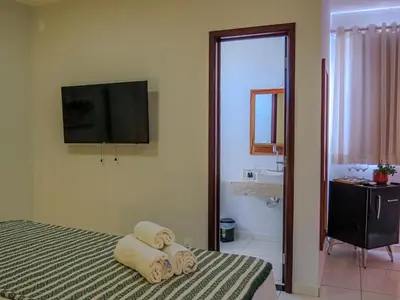 Uma televisão e/ou sistema de entretenimento em Oasis by Vila Coqueiros Cumbuco