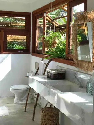 Uma área de estar em Chalé Koa Flora - PRAIA DE MOITAS