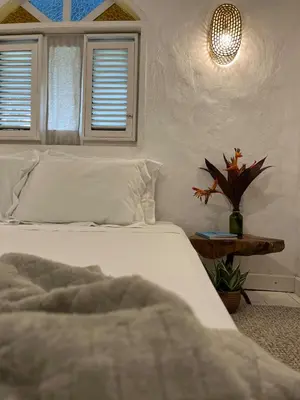 Uma cama ou camas num quarto em KOA Loft - Praia de Moitas