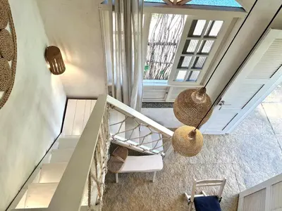Uma área de estar em KOA Loft - Praia de Moitas