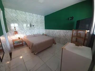 Uma cama ou camas num quarto em Pousada Sítio Boas Novas