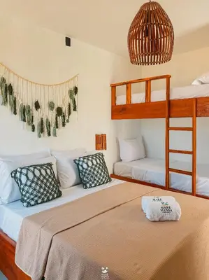 Uma cama ou camas num quarto em Maré Mansa Suítes Icaraizinho