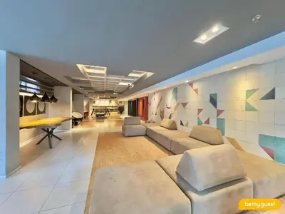 Uma área de estar em Loft Praia Entrelinhas