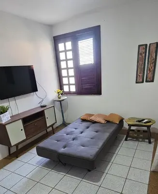 Uma televisão e/ou sistema de entretenimento em Casa de Condomínio em Porto das Dunas