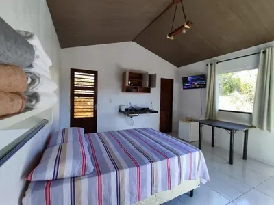 Uma cama ou camas num quarto em Chalé Bella Vista
