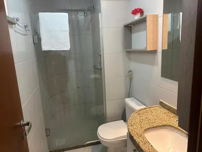 Uma casa de banho em Apto no Porto das Dunas - Scopa Beach