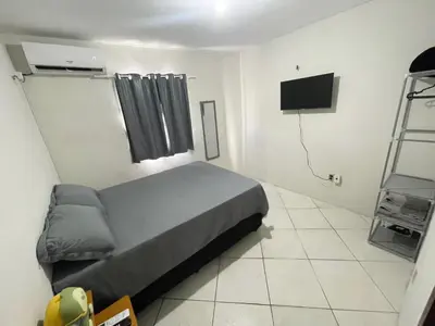 Uma cama ou camas num quarto em Apartamento completo e central! Casa Caju!